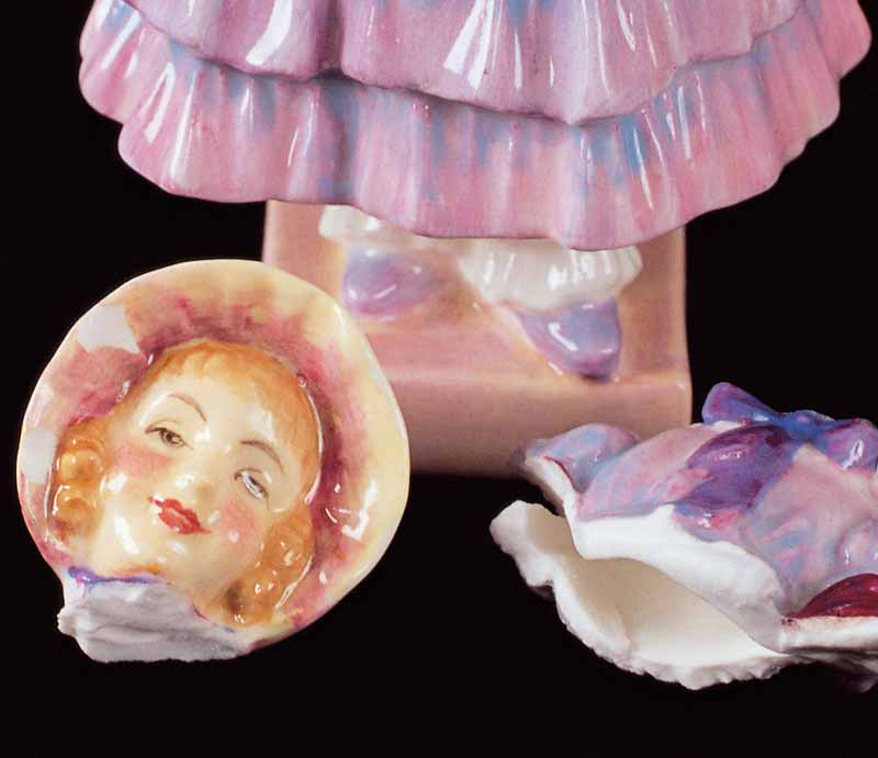 Detached head and broken torso.